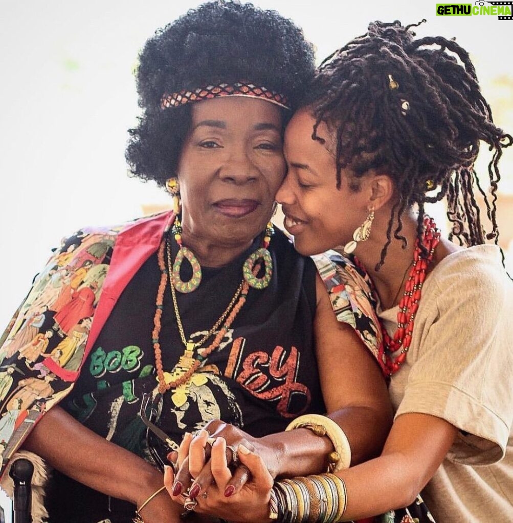 Donisha Rita Claire Prendergast Instagram - Grandma... You are the warmth of a Gentle Flame, the Cool of a Subtle Breeze, an Unquestionable Force of Light, Love, Leadership, Livity, and Laughter. A Visionary, a Teacher, a Survivor, a Souljah, a Goddess, a Queen. Your journey has been nothing short of Divinely crafted by the hands of the Most High. For you, there are not enough words to show how much you mean to me and millions of souls in the physical and spiritual manifest. 74 years on this Earth filled with lifetimes of experiences and HeArtwork. Keep on Keeping on.🔥💜🥳🦋🌏 Happy Earthday my Sweet Nana. We celebrate your everyday @officialritamarley. #TheRoot #TheFruit #IamBecauseYouAre #RastaWoman #FireStarter #LegacyKeeper #RitaMarley #74Strong 📸 @ahutchphoto