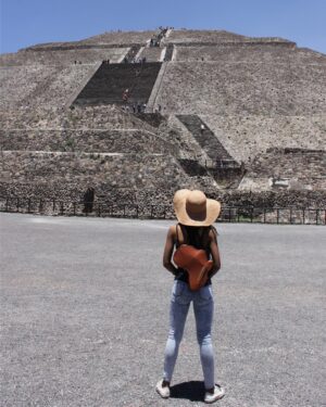 Donisha Rita Claire Prendergast Instagram - At the top of the pyramid there was no peak, only a flat platform where we all stood equally overlooking the valley below, reflecting on how many steps it took to get here. We all came from different places and arrived at different paces. Tourists, locals, young people, old people, newborns, even the sick and ailing. Some prayed, some laughed, some cried, some became a part of the silence that this moment demanded. A Recognition that a challenge had been conquered, a goal fulfilled, a memory restored, a promise kept. The Orijin of our reason to be here, in this now, was validated by us being here, in this now. 
Don’t discount your journey... or the journey of others just because you think they can’t walk in your shoes. You don’t know what they had to do to get shoes for their bare feet, or how much it took to put one foot in front of the other. Walk Good. Bag by @orijinculture #GiveThanks #HaveMercy #Grace #BeLove #Buildcomeunity #KeepOnMoving #Mentalhealthawareness #iexisteverywhere #orijinculture