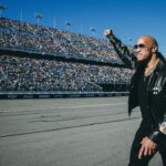 Dwayne Johnson Instagram – Unforgettable day of racing, chaos, love & ENERGY!!

Love y’all back and thank you so much for everything ✊🏾🖤

~ people’s champ 
#daytona500 
#grandmarshal 

(Rest in peace Big Dog 🕊️)

📸 • @thisisamandaw