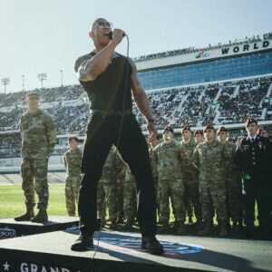 Dwayne Johnson Instagram - Microphone in hand. 
100,000+ strong. 
Live as the world watches. 

This is heaven. 
I’m a grateful I get to do crazy stuff like this. 

“In the proud spirit of America 
In the proud spirit of our great country 
FINALLY, The Rock says 
Drivers start your engines” 

#Daytona500
#GrandMarshall 
#PeoplesChamp 
@nascar 
@daytona

📸• @thisisamandaw