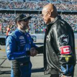 Dwayne Johnson Instagram - Great to meet the boys before they started kicking ass on that track 🫱🏼‍🫲🏾🏁 These @nascar drivers work their asses off and get pulled in a million different directions- I saw it up close and 💯 understand the push and pull energy they deal with. Much respect to these boys & their teams ☝🏾 #greatamericanrace #daytona500 @jimmiejohnson @rowdybusch @jhnemechek @davidlragan @rosschastain @ryanblaney10 @ryanpreece_ 📸: @thisisamandaw