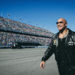 Dwayne Johnson Instagram – Unforgettable day of racing, chaos, love & ENERGY!!

Love y’all back and thank you so much for everything ✊🏾🖤

~ people’s champ 
#daytona500 
#grandmarshal 

(Rest in peace Big Dog 🕊️)

📸 • @thisisamandaw