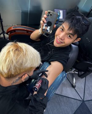 Elijah Canlas Instagram - Remember when you’d always joke about wanting to get a full sleeve of tattoos, JM? Tapos sasakyan ko yung pagbibiro mo kay mom until she gets pissed and tells us to not go home if we do push through with it. Guess what? Kuya Jerom and I just got tatted today. We even brought Iya with us. Mom’s fine with it now. She actually wants to get one herself. Even Dad wants to get tatted now. 

Pero siyempre tungkol sa’yo ang design. Your favorite thumbs up pose with your name enlaced on it designed by ate Zia. Our cousins also got the same design marked on them. Matching kami lahat. 

I want you with me forever and always. We all do. I can’t believe it hasn’t even been a month. Thank you for being my strength. I miss you so much it hurts. Pero kaya ito ni kuya. Kaya namin ito. We love you more than anything, JM! Habang buhay. Habambuhay.