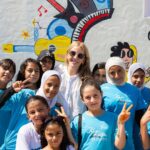Ellie Goulding Instagram - Yesterday I had the honour of opening the Zaatari Music & Arts Center at Zaatari Refugee Camp, Jordan . This is the largest refugee camp in the Middle East with 60% of the 85,000 residents under 25. It was an extraordinary privilege to meet young Syrian people and to get the opportunity see them not only as refugees but as musicians and artists and performers. I will remember and treasure their performances for a long time to come. To be a refugee is often to experience trauma, a removal of identity and the erasure of culture. It’s an existence that leaves little room for dreams. The Zaatari Music & Arts Center reinstates both dreams and hope. Thanks to this remarkable initiative, in this corner of the camp young people will now have access to classes in Guitar, Drums, Oud, Voice & Dance, a performance space and a recording studio. Music and the arts can help to heal trauma and to reconnect refugees with their culture and identity. I was also moved by the dedication of people and organisations working to help refugees at Zaatari. But despite the best efforts of the Jordanian services and many international agencies, international budgets for Syrian refugees are being cut. We must not forget that 110M people are currently forcibly displaced from their homes, which is the most since World War 2. My visit to Zaatari confirms my belief that only by coming together as a global community to support refugees properly can we give theses young people the beautiful future they deserve. Love Ellie x @dreamdayorg @playingforchangefoundation @questscope @toddkrim @fairmontamman