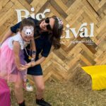 Ellie Taylor Instagram - Back from our first family festival foray @thebigfeastival! All of us had such an ace time and it was so brill for kidos. Highlights include ACTUAL JUSTIN FROM CBEEBIES WHO WAVED AT US, closely followed by Mel C (who for some reason my daughter insisted on referring to as ‘Tiramisu’) and naturally, HRH Rick Astley who was perfect for unleashing some unhinged mum dancing to. (Despite what the Rick video suggests, I hadn’t in fact broken in and scaled a fence - we were #gifted tickets and felt very lucky.) Now to sleep and convince my girl that three days is probbbbably long enough to keep the face gems on for… #bigfeastival The Big Feastival