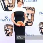 Ellie Taylor Instagram – Baby’s first BAFTA 💛
Swipe for generic posing followed by how I looked at the beginning of the day about to clean pigeon shit off the trampoline.
Make up @hannahmartinmakeup
Styling @tesswrightstylist
Dress @safiyaa_official
Clutch @cultgaia
Earrings @chanelofficial