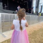 Ellie Taylor Instagram - Back from our first family festival foray @thebigfeastival! All of us had such an ace time and it was so brill for kidos. Highlights include ACTUAL JUSTIN FROM CBEEBIES WHO WAVED AT US, closely followed by Mel C (who for some reason my daughter insisted on referring to as ‘Tiramisu’) and naturally, HRH Rick Astley who was perfect for unleashing some unhinged mum dancing to. (Despite what the Rick video suggests, I hadn’t in fact broken in and scaled a fence - we were #gifted tickets and felt very lucky.) Now to sleep and convince my girl that three days is probbbbably long enough to keep the face gems on for… #bigfeastival The Big Feastival