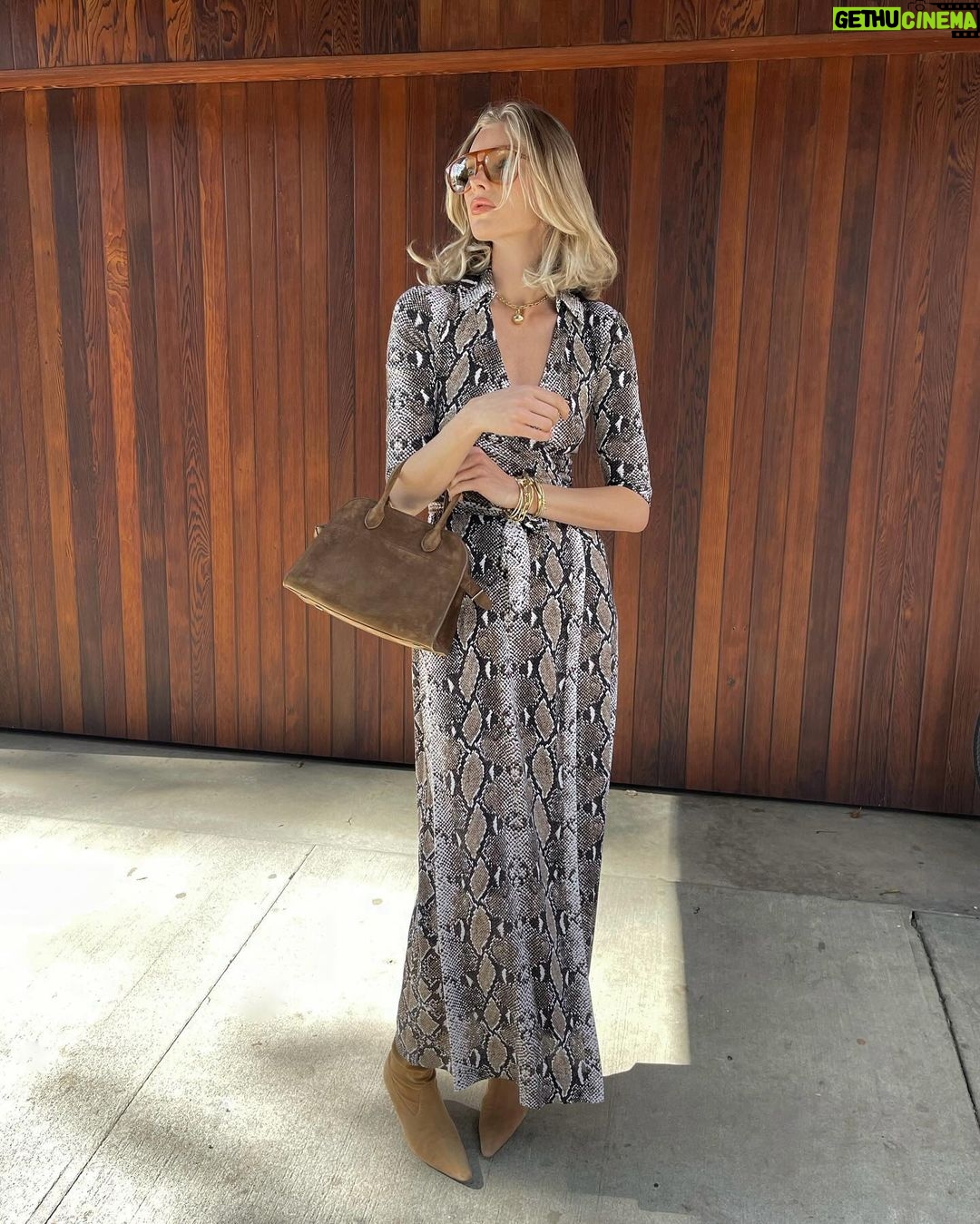 Elsa Hosk Instagram - giving ya sexy 70s secretary celebrating the 50th anniversary of the iconic @dvf wrap dress🤍 #wrap50