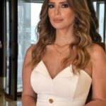 Eman El Assi Instagram - قَناعَه ثُم إبتِسَامَة لا تَحتَاج الحَياة أكثَر مِن ذَلك 🙏🏻🤍 ✨ Custome made jumpsuit by @dalidaayachboutique Styling : @omziag Jewels: @chatojewels Hair: @assaadhairdesign Makeup: @yarabazounmakeup @protocolprod