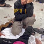 Eman El Assi Instagram - A young boy is watching his sister helplessly, as she lies on the floor of the hospital, after being injured by Israeli occupation airstrikes.