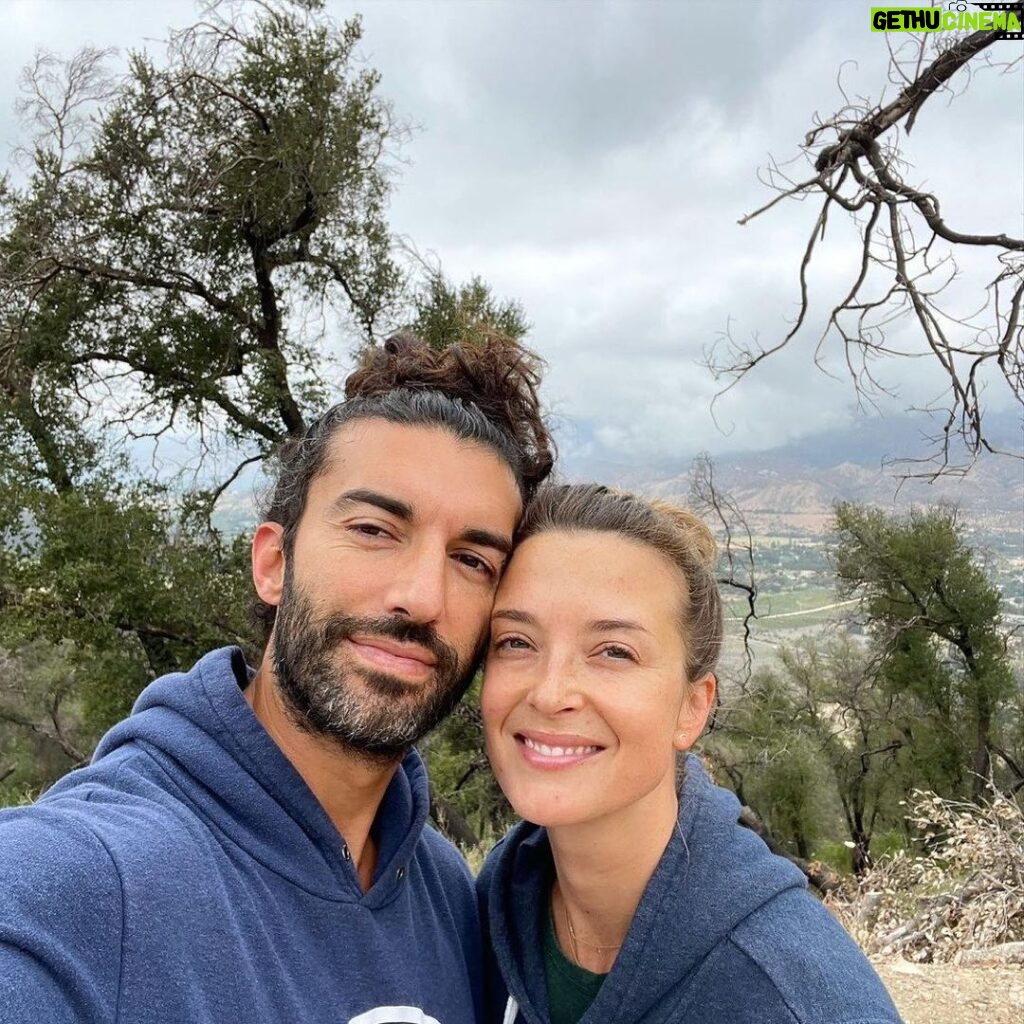 Emily Baldoni Instagram - On this #earthday we decided to take a morning hike. We thought these photos sum up the heartbreak of what we are doing to our planet. Just behind a gorgeous lookout lies a hideous oil well. Forcefully penetrating the earth and taking from it over and over again. If you look closely behind us you’ll also notice that the trees have black bark on them. Slowly recovering from the devastating #thomasfire a few years ago. This year in Southern California we are seeing unprecedented low levels of rain which is terrifying for coming fire season which the local fire department told us yesterday now lasts pretty much all year. And unfortunately, these are just a few examples of how we are knowingly continuing to destroy our beautiful home. If we want to have anything left of our planet to give to our children and grandchildren, we must work together and listen to the 97% of scientists who remind us that climate change is real. It’s not a hoax or some government conspiracy. It’s caused by us, but the good news is that it can also be fixed by us. Much of the damage can’t be undone, but we DO hold the power to reverse a lot of it. First we must come together and acknowledge the role we ALL play in it. #earthday #onlyoneplanet #onepeople