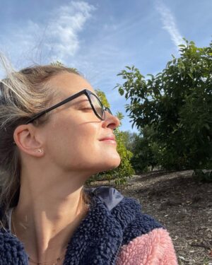 Emily Baldoni Instagram - One day I was sitting in my garden with my face towards the sun, in deep stillness. 

My inner critic showed up and began telling me: you’ve been sitting here too long. You’re not being useful. You’re not helping to heal the world by sitting here. Get up and go, there’s work to do. 

And then, this download came: 
I AM healing the world by sitting here. In a society addicted to doing, my stillness is the most radical form of activism and healing. 
I am creating stillness this world is starved of. 
A stillness which society so desperately wants me to stay tapped out of so I remain powerless.
Here in my stillness with nature, I’m finding knowledge I can’t find in a book. 
Inspiration I can’t find in a podcast. 
Activism I can’t find at a rally. 
A plugging in I can’t get at my work desk. 

Going inwards is never a waste of time.
It is in stillness and surrender that I find my true power and understanding. Living in, and acting from, that true power and understanding are some of the greatest acts of love and activism this world will ever know. 

“The outer work can never be small if the inner work is great. The outer work can never be great if the inner work is small” 
~ Meister Eckhart