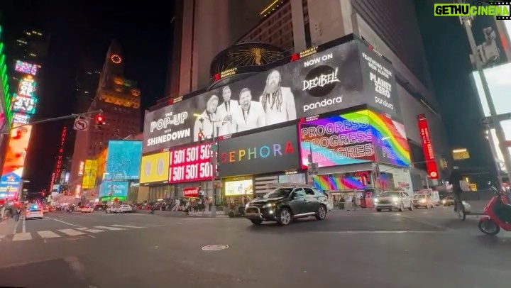 Eric Bass Instagram - They’ll put anybody up on a billboard in Times Square these days. 😳 😂 Couldn’t be more grateful for our team. #planetzero #shinedown #daylight #timessquare #release #releaseweek #blessed #purplehairdontcare #rock #rockisntdead