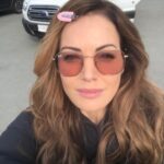 Erica Durance Instagram - Pink glasses, pink hair clip, pink lips. Getting ready to Rock as Lois...💃🏻💃🏻