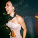Eva Marisol Gutowski Instagram – YA’LL WERE REALLY OUT HERE DOIN IT! 🥹😭 two things- 1. I’m headlining a special two hour set at Ludlow House tomorrow night. It will be different than my past shows and more vibey 👽 I’m on at 11 and supported by @zigie.music! 
2. Funny enough i dropped a SoundCloud set last week with the vibes and didn’t tell you guys. I didn’t mean to i just forgot 🫠 the sets called Flow State, because it reminds me of that good feeling you have when you wake up early to surf or pack the car for snowboarding or just getting into what you love. It’s in my bio. 
And why not 3. Thank you for supporting MARISOL. It’s been an insane last year getting back into it, and this year feels like I’m right where I’m meant to be 🥹❤️ These pics are from last week playing a UK/techno set! So thank you and let’s dance tomorrow! 🕺