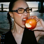 Eva Marisol Gutowski Instagram - Concrete jungle wet dream tomato 🍅 me on film in essentially my backyard. New York, New York