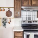 Evan Thomas Instagram - Cozy cabin vibes. #bargainblock Season 3 episode 2. Hope you liked last night’s episode! It was fun to renovate and design this house. We loved how the solution to the plumbing layout issues resulted in such a beautiful kitchen. Turning difficulties into design features is always so gratifying. Also LOVED how the butler’s pantry turned out with that vintage hutch. And that PLAID tile with those beautiful countertops 😍😍 What was your favorite part of last nights episode? Countertops: @greatlakesgm Tile: @virginiatilecompany Wallpaper: @detroitwallpaper Coffee table: @motorcitybarrels Detroit, Michigan