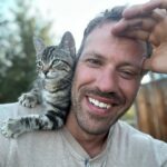Falk Hentschel Instagram - This guy came by for a photoshoot on the ranch. I feel like he kinda mimicked my expression/vibe for each pic. He tries to hang out on my shoulder whenever i sit down anywhere. Lovely company. Minus the claws in my back as he takes his seat.😃