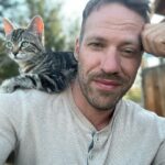 Falk Hentschel Instagram - This guy came by for a photoshoot on the ranch. I feel like he kinda mimicked my expression/vibe for each pic. He tries to hang out on my shoulder whenever i sit down anywhere. Lovely company. Minus the claws in my back as he takes his seat.😃