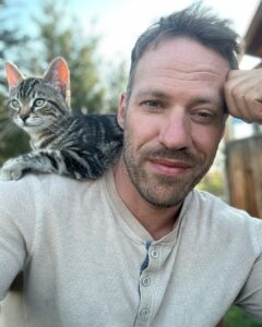 Falk Hentschel Instagram - This guy came by for a photoshoot on the ranch. I feel like he kinda mimicked my expression/vibe for each pic. He tries to hang out on my shoulder whenever i sit down anywhere. Lovely company. Minus the claws in my back as he takes his seat.😃
