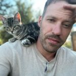 Falk Hentschel Instagram - This guy came by for a photoshoot on the ranch. I feel like he kinda mimicked my expression/vibe for each pic. He tries to hang out on my shoulder whenever i sit down anywhere. Lovely company. Minus the claws in my back as he takes his seat.😃