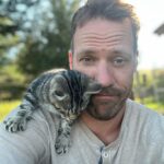Falk Hentschel Instagram - This guy came by for a photoshoot on the ranch. I feel like he kinda mimicked my expression/vibe for each pic. He tries to hang out on my shoulder whenever i sit down anywhere. Lovely company. Minus the claws in my back as he takes his seat.😃