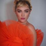 Florence Pugh Instagram - This piece of art was insane. What it then brought out of everyone else’s creativity adding to it was equally unstoppable and impressive. @harris_reed allowed me to be a part of sharing some of his first work at @ninaricci which I am eternally grateful for. Thank you to the many hands of artists who made all of this- genius. Including my epic team who deliver EVERY. SINGLE. TIME. @peterluxhair on hair @babskymakeup on makeup @rebeccacorbinmurray styling @nailglam on nails @colorbymattrez on colour @tiffanyandco jewels 🧡🍑🍊🦁