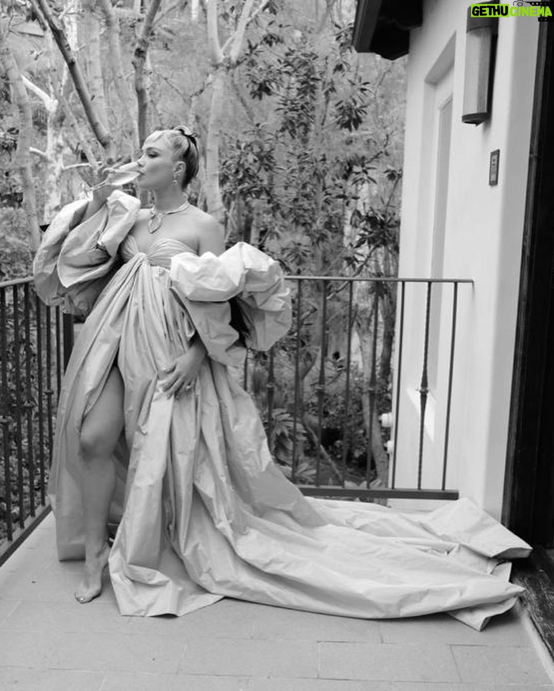 Florence Pugh Instagram - Wet stairs and @maisonvalentino gowns go perfectly.. With HUGE thanks to the talented hands that got me out the door. Another unbelievable Valentino moment, @pppiccioli and I played dress up last week in Paris and he draped this on me and safe to say we fell in love with the drama. He followed me around with his phone taking pictures of every angle. Video to come… I love the fun that explodes from his gowns, it truly is playing the best dress up my 6 year old self could possibly imagine. So happy to have these moments captured by @gregwilliamsphotography, always a pleasure prancing and blowing kisses in a garden. #maisonvalentino #oscars95