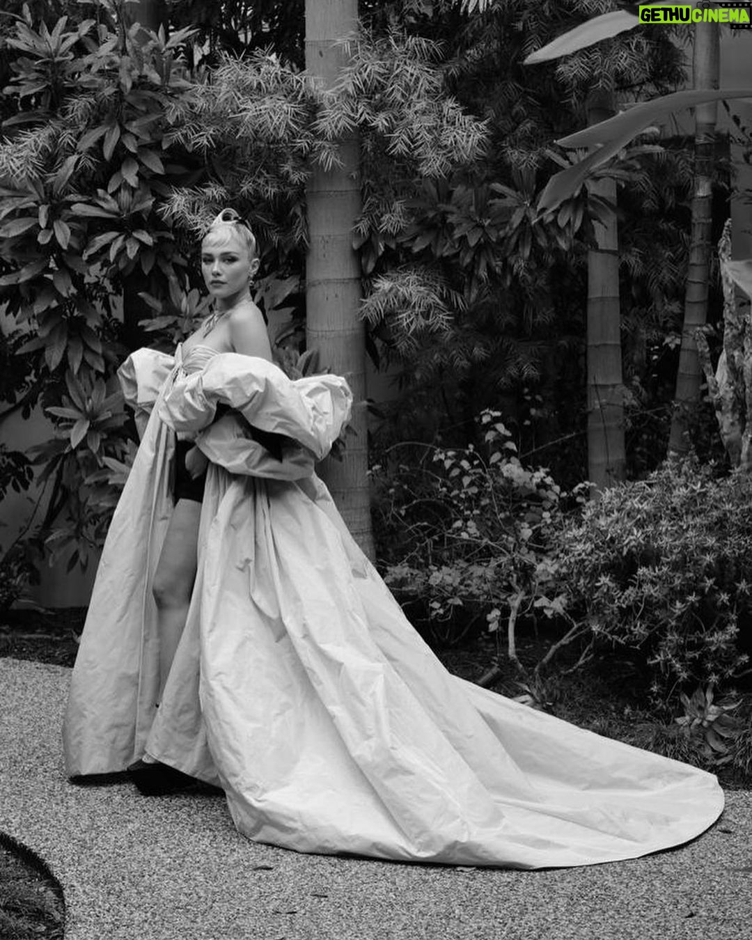 Florence Pugh Instagram - Wet stairs and @maisonvalentino gowns go perfectly.. With HUGE thanks to the talented hands that got me out the door. Another unbelievable Valentino moment, @pppiccioli and I played dress up last week in Paris and he draped this on me and safe to say we fell in love with the drama. He followed me around with his phone taking pictures of every angle. Video to come… I love the fun that explodes from his gowns, it truly is playing the best dress up my 6 year old self could possibly imagine. So happy to have these moments captured by @gregwilliamsphotography, always a pleasure prancing and blowing kisses in a garden. #maisonvalentino #oscars95