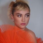 Florence Pugh Instagram - This piece of art was insane. What it then brought out of everyone else’s creativity adding to it was equally unstoppable and impressive. @harris_reed allowed me to be a part of sharing some of his first work at @ninaricci which I am eternally grateful for. Thank you to the many hands of artists who made all of this- genius. Including my epic team who deliver EVERY. SINGLE. TIME. @peterluxhair on hair @babskymakeup on makeup @rebeccacorbinmurray styling @nailglam on nails @colorbymattrez on colour @tiffanyandco jewels 🧡🍑🍊🦁