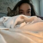 Genevieve Kang Instagram - ‘Zoey’ means life, and she enriched mine in ways I’ll be forever grateful. Zo and I met on Craigslist in 2010, it’s the only time I’ve ever online dated. we looked each other straight in the eyes and declared ourselves soulmates. Zo was my companion, a part of me. if you loved me, you had no choice but to love her too. Zo was my teacher (still is). she taught me about healthy boundaries, self-worth, and getting what you want. she taught me to never settle for anything less than what I deserve. she taught me to not take things so personally. she taught me that love isn’t to grasp or control, but rather to let go. she taught me to slow down. Zo was the kind of cat that made people who disliked cats, love cats. Zo may have left us earth side but her cheeky spirit remains with me — right now, she’s def laughing. with so much change happening in my life recently, it feels both heartbreaking and purposeful that Zo wasn’t meant to come along for this ride. but rather, her exit was meant to usher me into the next chapter. she’s witchy like that. thank you to everyone who has reached out with support. rest assured, the immense strength, love, and the endless lessons this incredible girl brought to me far outweigh the inevitable pain of loss. death and letting go are a part of life, and I’m so incredibly lucky Zoey chose me for it all. photo taken earlier this year by my dear friend @cristinagareau