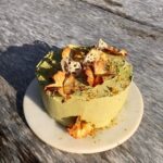 Genevieve Kang Instagram - ‘twas the sunniest of solar returns. bday tradition, year 35—gf lemon pineapple cake w honey walnut cream filling, matcha frosting, pineapple flowers, lotus root, bee pollen, chrysanthemum.