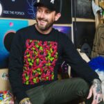 Geoff Ramsey Instagram - If you want to look as happy as I’m pretending to be in this pic, maybe buy a shirt. Or whatever. I don’t know. I’m not your dad. Link in bio. Photo by @atwes