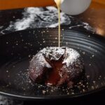 Gordon Ramsay Instagram - Gooey Christmas pudding chocolate fondant with brandy custard at @breadstreetkitchen !! Bread Street Kitchen