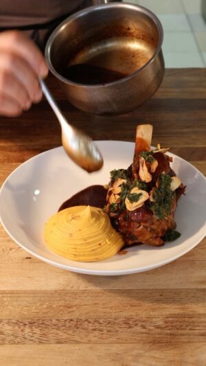 Gordon Ramsay Instagram - Beautiful braised lamb shank served with harissa mash, black olive jus and gremolata at @gordonramsaybarandgrill !!