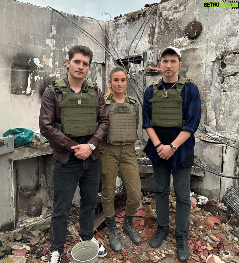 Gregg Sulkin Instagram - Standing amid the haunting remains of a Kibbutz struck by the October 7th tragedy, 76 days post-atrocity. While the physical remnants of devastation – including dead bodies have been cleared, the air still carries the heavy scent of loss and sorrow. These visuals, stark and sobering, serve as a poignant reminder: this is the reality of hate, unmasked and cruel. To every soul touched by this dark chapter, my heart extends its deepest empathy. This was not just an attack on the Jewish community, but an assault on humanity’s very essence. We must all shoulder the responsibility to remember and to educate, ensuring such horrors are relegated firmly to the past. I wish for harmony for all. We stand together, beyond religion or race, united in our unwavering resolve: Never Again. Amid this resolve, we must not forget the innocent hostages still being held against their wills. For them, and their anguished loved ones, I pray fervently for a safe and swift release. In the tender silence that follows grief, let us find the strength to turn our collective mourning into a beacon of hope and compassion, illuminating a future where peace and empathy reign over discord and division. Kibbutz Kfar Azza