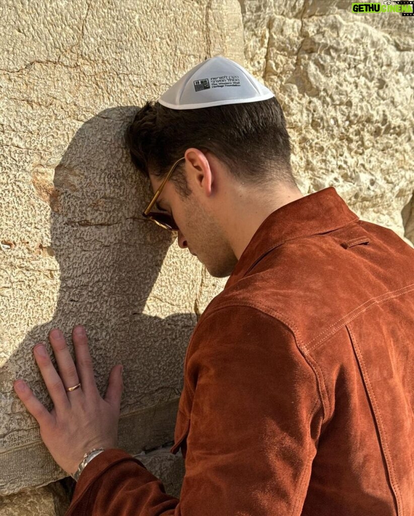 Gregg Sulkin Instagram - Returning to the Western Wall, years after my Bar Mitzvah, I felt a profound connection to my heritage. Standing here, I am reminded of the enduring spirit and resilience of the Jewish people. In the shadow of these ancient stones, I reflect on our everlasting prayers for peace. Proud of my roots, humbled by our history, and committed to a future where peace reigns supreme. Western Wall Jerusalem