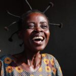 Gugu Mbatha-Raw Instagram - An honour to paint the pure joy of Veronique, a woman I met on my recent trip to DRC. ✨ I heard a lot of heartbreaking stories during my visit with @refugees but also witnessed moments of deep joy, resilience and triumph, made all the more poignant because of the pain experienced along the way. In this moment, Vero, as she introduced herself, was celebrating her new home. After years of displacement and time in Angola as a refugee, Vero, who had been identified as especially vulnerable, was finally moving from a temporary settlement to new housing shelter project with her 4 children. I had the honour of handing over the keys! There has been a lot to process about this trip. Painting has helped. Vero’s spirit reminded me to be grateful for a home and how precious it is to have shelter, something many displaced people in DRC desperately need. See link in bio for ways you can support someone like Veronique and her family. ❤️ #joy #art #home Democratic Republic of the Congo