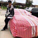 Gus De St. Jeor Instagram - My bros gave me a nice Christmas wrap for the holidays... what do you guys think? 👀🎁 Go check the link in my bio to see my first reaction