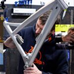 Guy Martin Instagram - How Trick is this! Guy has been riding @orangebikes for as long as he can remember, when we nudged him for an exact date we got “I've had a few hot dinners since then”. He put in a call to Orange a few weeks back as he wanted to buy a new frame, his old bike was knackered and after 35,000 miles in 7 years it needed retiring. His orange hasn’t been on all his biking adventures but it is the bike that he rides the most on his daily commute to work. The lads and lassies at Orange Bikes and @hopetech built him this trick aluminium brushed frame with Hope accessories. They arrived to his work last week and he was proper blown away by the bike as you can see in the video. Massive thanks to everyone at Orange Bikes and Hope Technology Ltd for their continued support of Guys biking. #orangebikes #hopetech #guymartin