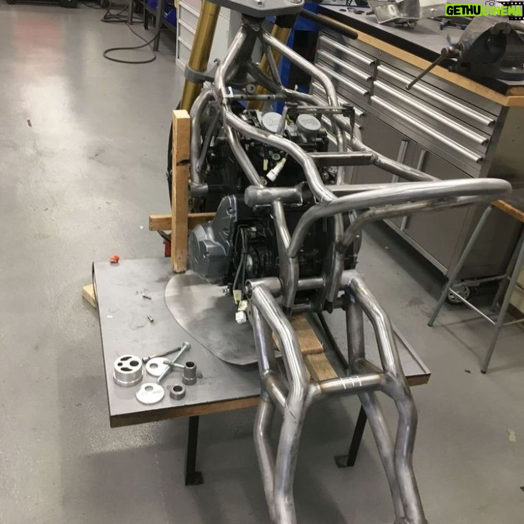 Guy Martin Instagram - During Lockdown Guy has managed to keep himself busy with work on the tractor, a filming job for the new year, PROJECT300 and of course lots of jobs on in the shed. He also however found time to lend his knowledge and experience to a new but old venture. Doctor Tony Keating from @keatingsupercars and Bolton University NCME National Centre for Motorsport Engineering, Gary Hewitt and Ian Martin from ELAS and owners of the Dot brand have decided to bring life back to a historic British motorcycle, Dot. Gary and Ian are long time personal sponsors of Guy, naturally they asked Guy for his input. Over the past few months Dr Keating and his team have developed and manufactured a cafe racer style motorbike and Guy has had an eye on the project from the start, giving them valuable advice on set up and style. Dr Keating and his team will be ready in the not to distant future to reveal DOT in all her glory. @dot.motorcycles