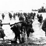 Guy Martin Instagram - On 6 June 1944, Allied forces launched the largest combined naval, air and land operation in the history of warfare: D-Day. “We shall defend our Island, whatever the cost may be; we shall fight on the beaches, we shall fight on the landing grounds, we shall fight in the fields and in the streets, we shall fight in the hills; we shall never surrender.” Winston Churchill #lestweforget