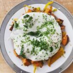 Gwyneth Paltrow Instagram – #boyfriendbreakfast today was an easy sweet potato hash. 
Sweat some onions
Add some bell peppers and let caramalize about 10-15 mins 
Cube and boil sweet potatoes in salted boiling water about 10 mins and let steam and dry in the colander when ready
Add garlic and cook with the peppers and onions 
Add sweet potatoes, some paprika and chili powder to taste
Add scallions and cook for a few to let all flavors combine
Fry your eggs adding water, my new favorite trick 
 Season and add something green, I had parsley and chives so I went with that #paleo
