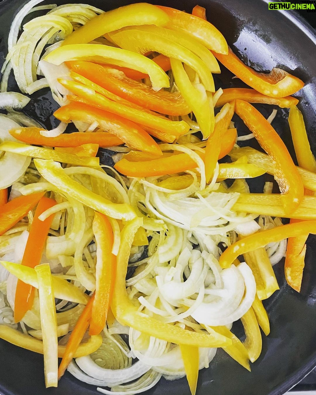 Gwyneth Paltrow Instagram - #boyfriendbreakfast today was an easy sweet potato hash. Sweat some onions Add some bell peppers and let caramalize about 10-15 mins Cube and boil sweet potatoes in salted boiling water about 10 mins and let steam and dry in the colander when ready Add garlic and cook with the peppers and onions Add sweet potatoes, some paprika and chili powder to taste Add scallions and cook for a few to let all flavors combine Fry your eggs adding water, my new favorite trick Season and add something green, I had parsley and chives so I went with that #paleo