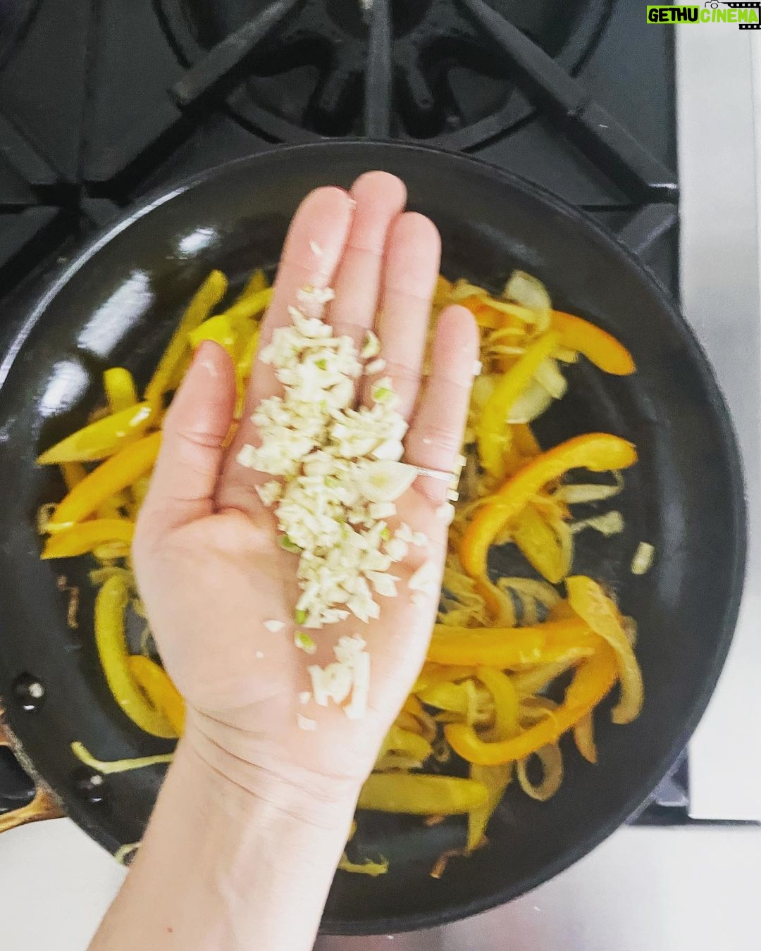 Gwyneth Paltrow Instagram - #boyfriendbreakfast today was an easy sweet potato hash. Sweat some onions Add some bell peppers and let caramalize about 10-15 mins Cube and boil sweet potatoes in salted boiling water about 10 mins and let steam and dry in the colander when ready Add garlic and cook with the peppers and onions Add sweet potatoes, some paprika and chili powder to taste Add scallions and cook for a few to let all flavors combine Fry your eggs adding water, my new favorite trick Season and add something green, I had parsley and chives so I went with that #paleo