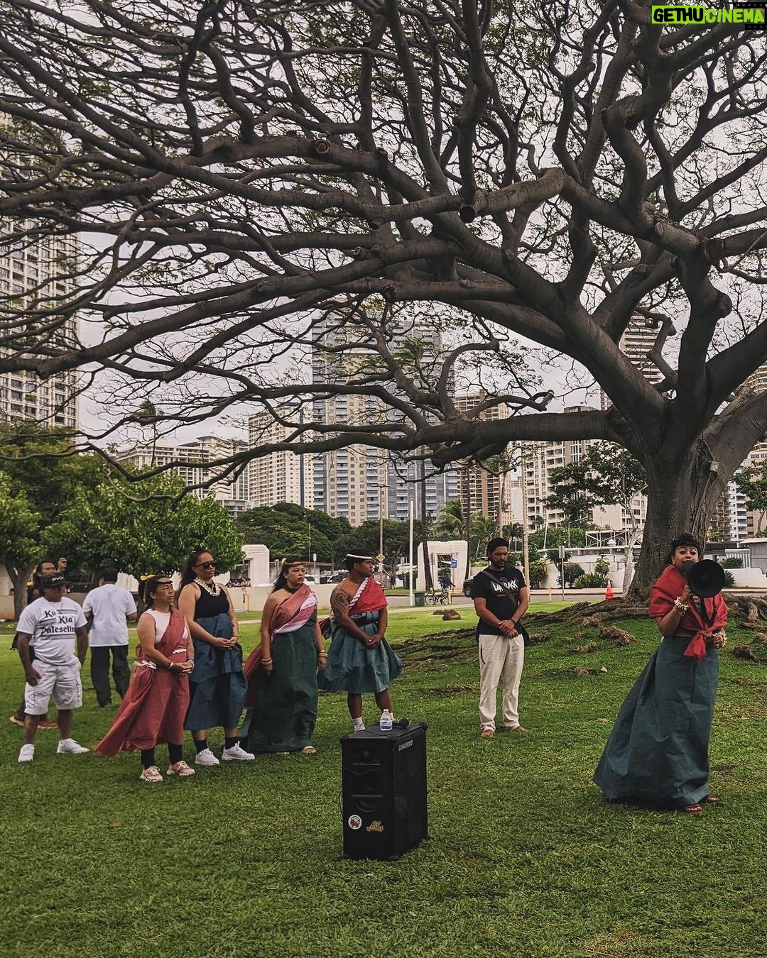 Hāwane Rios Instagram - from mauna kea to palestine we stand with you now & forever and when we say that we mean it with everything we are 🤍 pa’akai & protocols as we adorned in regalia to make offerings as we secured each pā‘ū with kākua as we placed our feathers on the summit of our heads as we tied our kīhei around of shoulders i gave thanks for all of our teachers all of our elders who showed the way who taught us that solidarity means ‘ohana who taught us that protocol is a sacred necessity who taught us that prayer is our first layer of armor oh how many times we have marched these streets chanting for justice and change for as long as i am here i will stand for what i know in my soul is pono & i will chant alongside these people right here for the rest of my days they are to me what the measure of a true aloha ‘āina really is we stood together for over a decade and now we stand together for Palestine aloha nā waipuna me nā ki‘owai o palekekina mai nā kahawai a hiki loa i ka moananuiākea e mau ke ea o ka ‘āina i ka pono i ke aloha i ka ‘oia‘i‘o kũ nā kia’i mauna a wākea kū nā kia’i palesetina ē inshallah ē to palestine, with love ‘āmama ameen 📸: @queer_kanaka 🌀