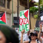 Hāwane Rios Instagram - ‘Kū Kia’i Palesetina // Solidarity March for Peace // January 28, 2024 in Honolulu, Hawai’i’ Honored to have laid down footsteps and offerings of chant and song to call for a permanent ceasefire and absolute end to the genocide of Palestine, Congo, Sudan, West Papua and all places and people suffering the devastation and soul shattering anguish of the evil powers that be. I have marched adorned in my regalia, in my sacred ‘a‘ahu since the first march we were asked to offer protocol for in 2012 for the ‘A‘ole GMO Movement in Hilo Hanakahi. It was so powerful to ‘a‘ahu in regalia alongside people that I have been in ceremony with for the past three years. We adorned in pā‘ū, kākua, lei hulu, lei momi, lei aloha from every sacred moment in prayer we have shared together in the places with stand for. When we ‘a‘ahu and when we oli, we are bringing the best of ourselves and the highest of our offerings to the place and the people we are standing up in solidarity for. I looked around and saw the words Kū Kia‘i Palesetina everywhere my eyes landed and all I could think of was how incredibly powerful it is to affirm our love for a place most of us have never been in our language and in the language of our movement for Mauna Kea which brought us into relationship on the Ala Hulu Kūpuna. So when we chant and when we include the God of the people we stand with in our prayers, it is our highest, most sacred of ceremonial expressions of devotion. I don’t just stand for Palestine. I have come to deeply love Palestine. And that is why I promise to keep speaking, keep marching, and keep posting as much as I possibly can. Because it is, to me, the correct thing to do. It is the kūpono thing to do. It is the kūpono person to be and continue to become. Aloha nā waipuna me nā ki’owai o Paleketina Mai nā kahawai a hiki loa i ka Moananuiākea E mau ke ea o ka ‘āina i ka pono I ke aloha i ka ‘oia’i’o Kū nā Kia’i Mauna a Wākea Kū nā kia’i Paleketina Inshallah Ameen From the river to the sea Palestine and Hawai’i shall be free 📸: @jenmay Puu Huluhulu