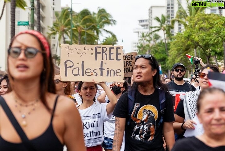 Hāwane Rios Instagram - ‘Kū Kia’i Palesetina // Solidarity March for Peace // January 28, 2024 in Honolulu, Hawai’i’ Honored to have laid down footsteps and offerings of chant and song to call for a permanent ceasefire and absolute end to the genocide of Palestine, Congo, Sudan, West Papua and all places and people suffering the devastation and soul shattering anguish of the evil powers that be. I have marched adorned in my regalia, in my sacred ‘a‘ahu since the first march we were asked to offer protocol for in 2012 for the ‘A‘ole GMO Movement in Hilo Hanakahi. It was so powerful to ‘a‘ahu in regalia alongside people that I have been in ceremony with for the past three years. We adorned in pā‘ū, kākua, lei hulu, lei momi, lei aloha from every sacred moment in prayer we have shared together in the places with stand for. When we ‘a‘ahu and when we oli, we are bringing the best of ourselves and the highest of our offerings to the place and the people we are standing up in solidarity for. I looked around and saw the words Kū Kia‘i Palesetina everywhere my eyes landed and all I could think of was how incredibly powerful it is to affirm our love for a place most of us have never been in our language and in the language of our movement for Mauna Kea which brought us into relationship on the Ala Hulu Kūpuna. So when we chant and when we include the God of the people we stand with in our prayers, it is our highest, most sacred of ceremonial expressions of devotion. I don’t just stand for Palestine. I have come to deeply love Palestine. And that is why I promise to keep speaking, keep marching, and keep posting as much as I possibly can. Because it is, to me, the correct thing to do. It is the kūpono thing to do. It is the kūpono person to be and continue to become. Aloha nā waipuna me nā ki’owai o Paleketina Mai nā kahawai a hiki loa i ka Moananuiākea E mau ke ea o ka ‘āina i ka pono I ke aloha i ka ‘oia’i’o Kū nā Kia’i Mauna a Wākea Kū nā kia’i Paleketina Inshallah Ameen From the river to the sea Palestine and Hawai’i shall be free 📸: @jenmay Puu Huluhulu
