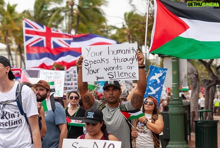 Hāwane Rios Instagram - ‘Kū Kia’i Palesetina // Solidarity March for Peace // January 28, 2024 in Honolulu, Hawai’i’ Honored to have laid down footsteps and offerings of chant and song to call for a permanent ceasefire and absolute end to the genocide of Palestine, Congo, Sudan, West Papua and all places and people suffering the devastation and soul shattering anguish of the evil powers that be. I have marched adorned in my regalia, in my sacred ‘a‘ahu since the first march we were asked to offer protocol for in 2012 for the ‘A‘ole GMO Movement in Hilo Hanakahi. It was so powerful to ‘a‘ahu in regalia alongside people that I have been in ceremony with for the past three years. We adorned in pā‘ū, kākua, lei hulu, lei momi, lei aloha from every sacred moment in prayer we have shared together in the places with stand for. When we ‘a‘ahu and when we oli, we are bringing the best of ourselves and the highest of our offerings to the place and the people we are standing up in solidarity for. I looked around and saw the words Kū Kia‘i Palesetina everywhere my eyes landed and all I could think of was how incredibly powerful it is to affirm our love for a place most of us have never been in our language and in the language of our movement for Mauna Kea which brought us into relationship on the Ala Hulu Kūpuna. So when we chant and when we include the God of the people we stand with in our prayers, it is our highest, most sacred of ceremonial expressions of devotion. I don’t just stand for Palestine. I have come to deeply love Palestine. And that is why I promise to keep speaking, keep marching, and keep posting as much as I possibly can. Because it is, to me, the correct thing to do. It is the kūpono thing to do. It is the kūpono person to be and continue to become. Aloha nā waipuna me nā ki’owai o Paleketina Mai nā kahawai a hiki loa i ka Moananuiākea E mau ke ea o ka ‘āina i ka pono I ke aloha i ka ‘oia’i’o Kū nā Kia’i Mauna a Wākea Kū nā kia’i Paleketina Inshallah Ameen From the river to the sea Palestine and Hawai’i shall be free 📸: @jenmay Puu Huluhulu