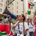 Hāwane Rios Instagram - ‘Kū Kia’i Palesetina // Solidarity March for Peace // January 28, 2024 in Honolulu, Hawai’i’ Honored to have laid down footsteps and offerings of chant and song to call for a permanent ceasefire and absolute end to the genocide of Palestine, Congo, Sudan, West Papua and all places and people suffering the devastation and soul shattering anguish of the evil powers that be. I have marched adorned in my regalia, in my sacred ‘a‘ahu since the first march we were asked to offer protocol for in 2012 for the ‘A‘ole GMO Movement in Hilo Hanakahi. It was so powerful to ‘a‘ahu in regalia alongside people that I have been in ceremony with for the past three years. We adorned in pā‘ū, kākua, lei hulu, lei momi, lei aloha from every sacred moment in prayer we have shared together in the places with stand for. When we ‘a‘ahu and when we oli, we are bringing the best of ourselves and the highest of our offerings to the place and the people we are standing up in solidarity for. I looked around and saw the words Kū Kia‘i Palesetina everywhere my eyes landed and all I could think of was how incredibly powerful it is to affirm our love for a place most of us have never been in our language and in the language of our movement for Mauna Kea which brought us into relationship on the Ala Hulu Kūpuna. So when we chant and when we include the God of the people we stand with in our prayers, it is our highest, most sacred of ceremonial expressions of devotion. I don’t just stand for Palestine. I have come to deeply love Palestine. And that is why I promise to keep speaking, keep marching, and keep posting as much as I possibly can. Because it is, to me, the correct thing to do. It is the kūpono thing to do. It is the kūpono person to be and continue to become. Aloha nā waipuna me nā ki’owai o Paleketina Mai nā kahawai a hiki loa i ka Moananuiākea E mau ke ea o ka ‘āina i ka pono I ke aloha i ka ‘oia’i’o Kū nā Kia’i Mauna a Wākea Kū nā kia’i Paleketina Inshallah Ameen From the river to the sea Palestine and Hawai’i shall be free 📸: @jenmay Puu Huluhulu